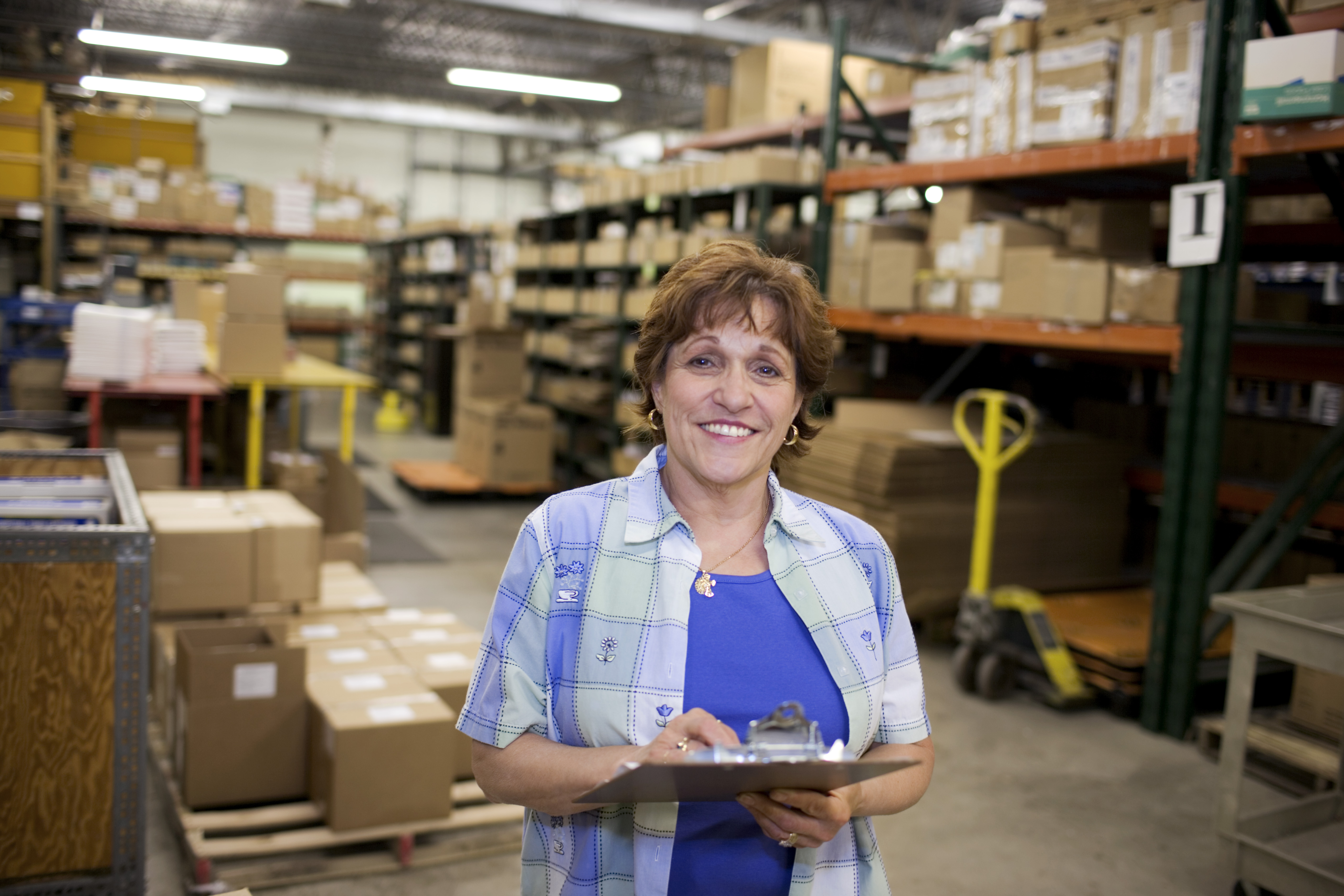 Woman Smiling inside Warehouse